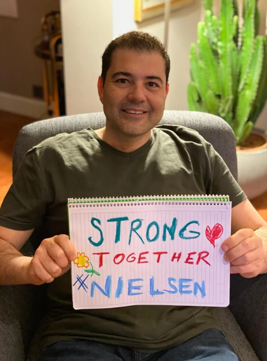 Stronger together: A moment of team solidarity during the COVID period, captured in the message “Strong together Nielsen.”